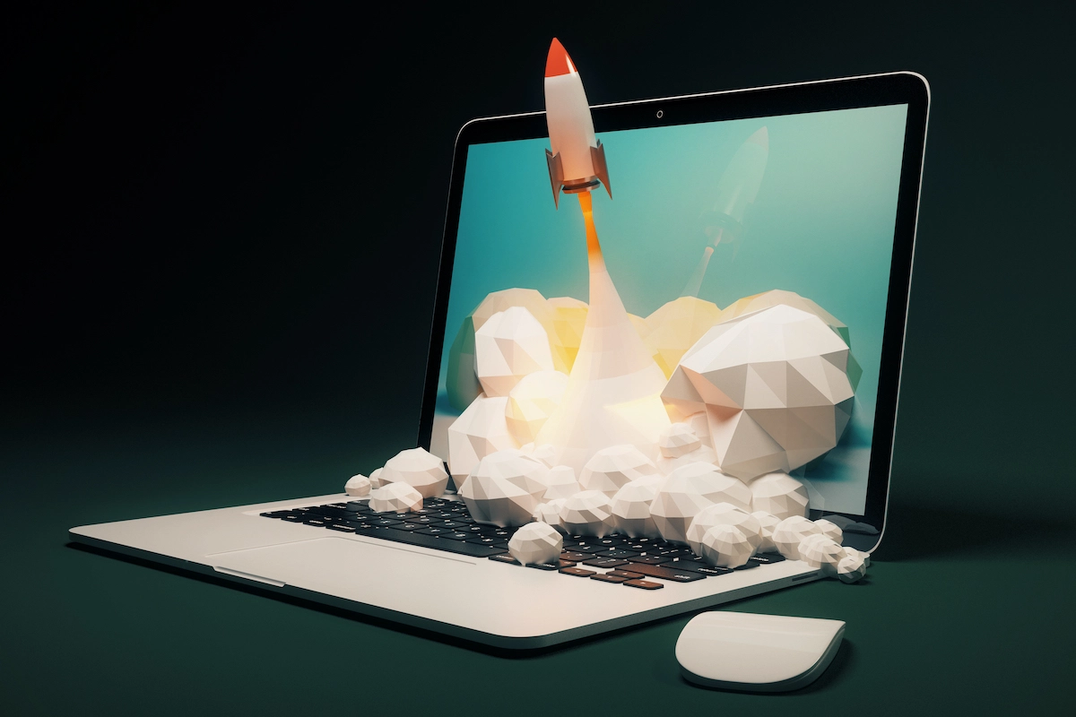 graphic of rocket ship taking off from a computer to depict successful business launch with a digital marketing strategy