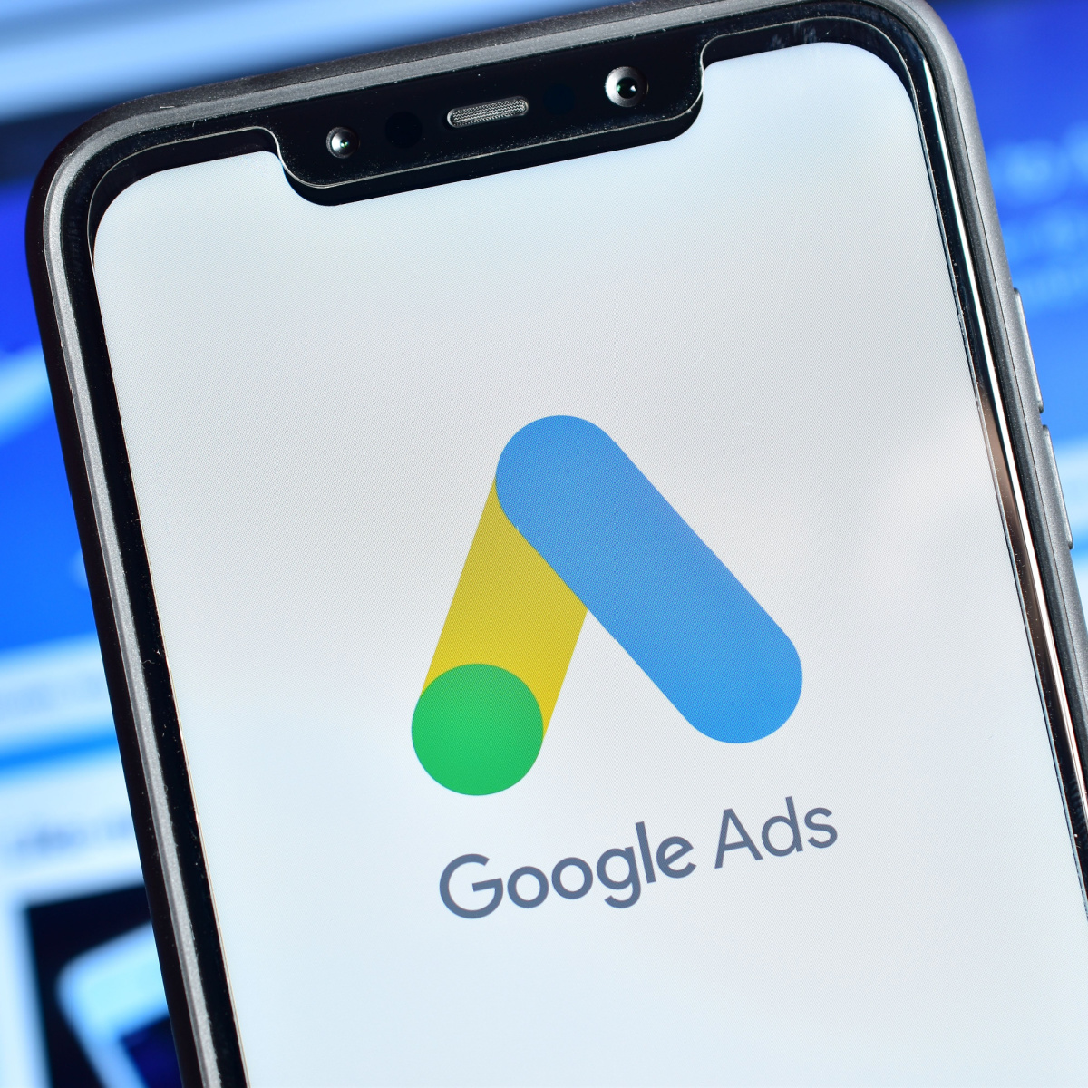 A phone displaying the Google Ads app