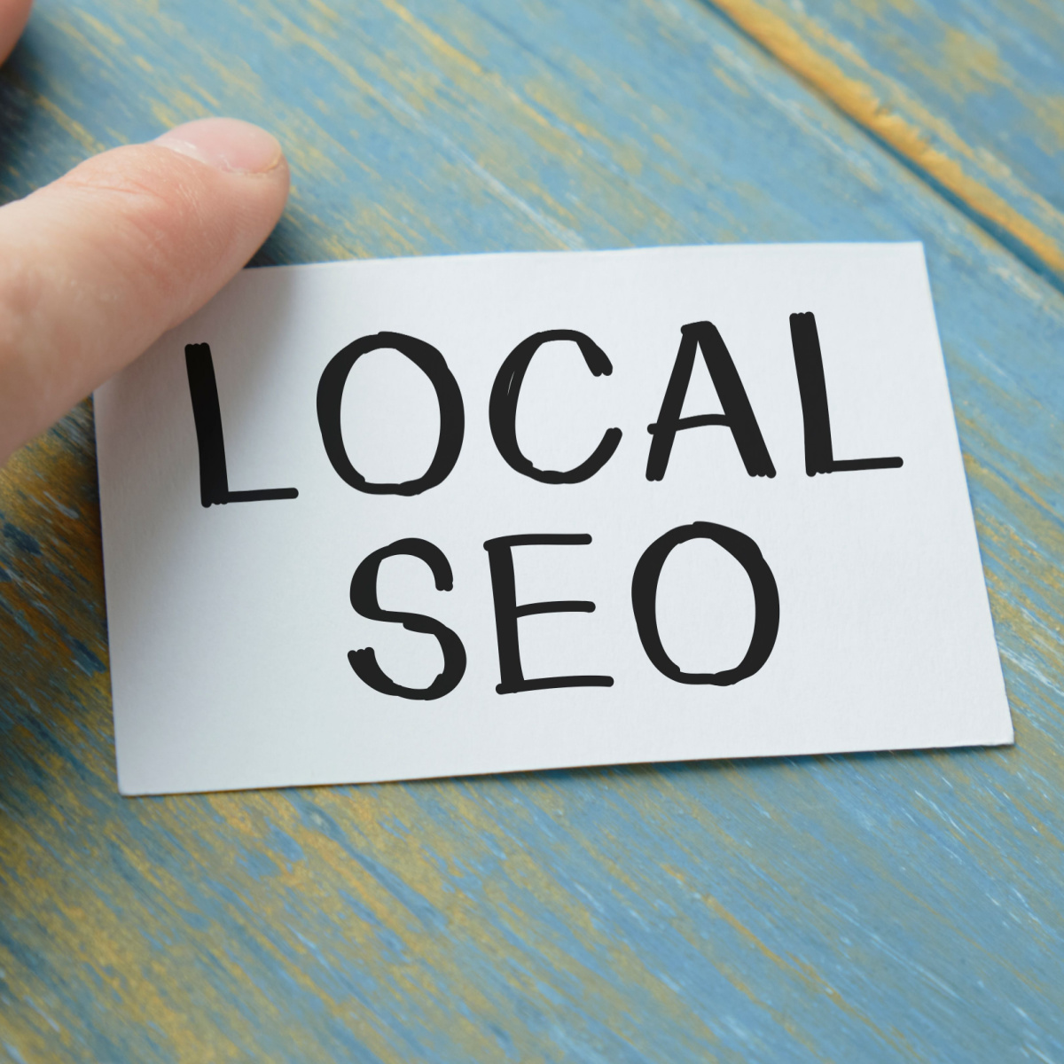 Business owner makes a note to remind him about the importance of Local SEO to his Houston digital marketing efforts.