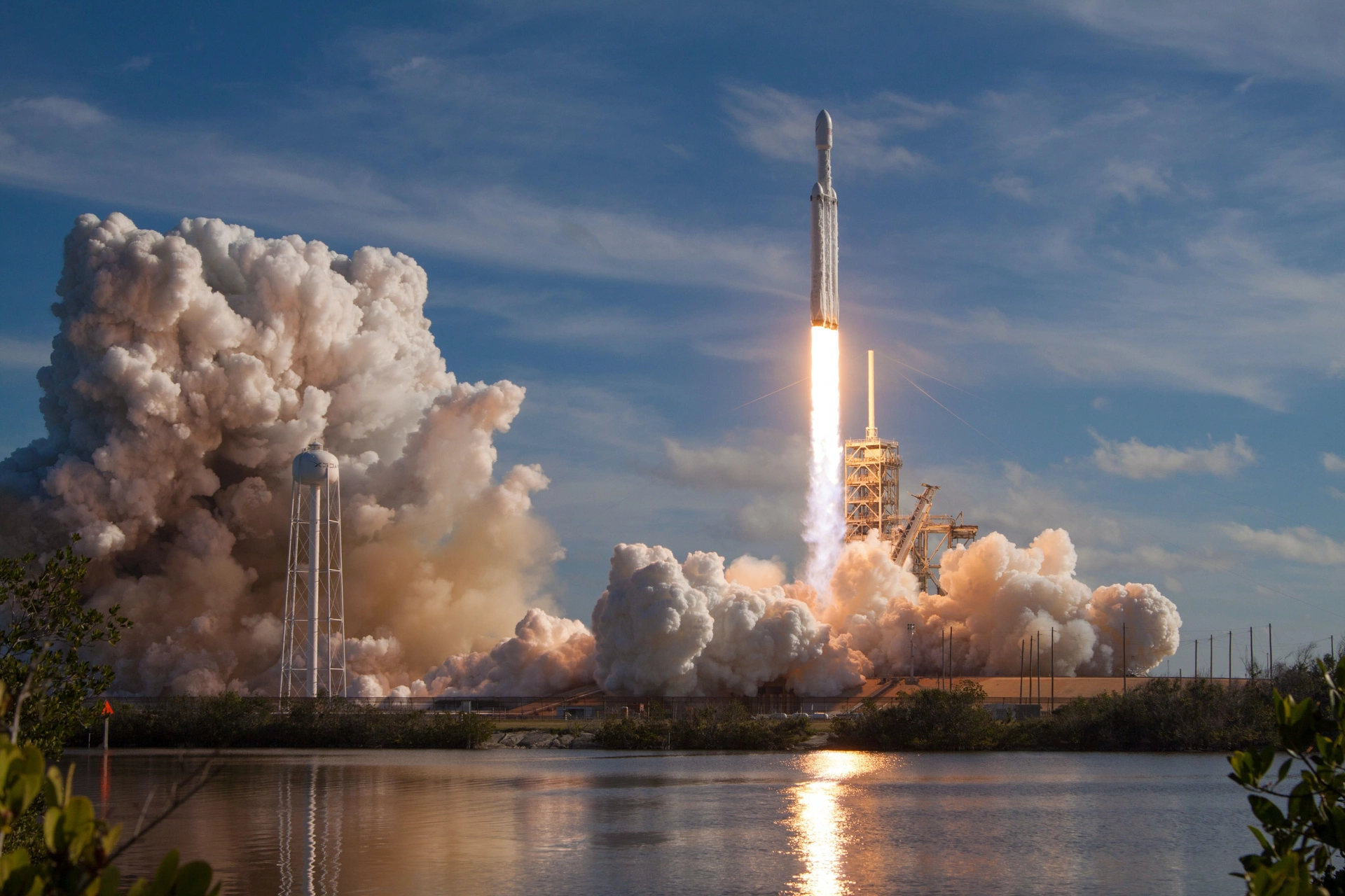 A SpaceX Falcon Heavy rocket launching into a blue sky, symbolizing a brand's rapid growth and trajectory.