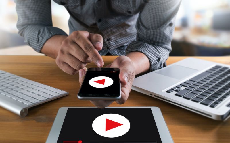 marketing professional testing video marketing on desktop website, tablet website, and mobile website
