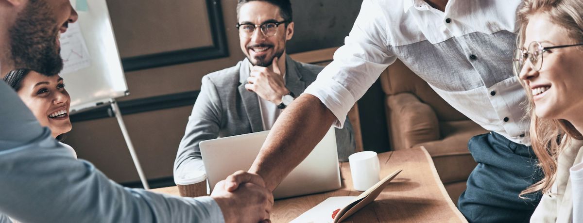 team closing a new deal with a marketing agency to expand their business