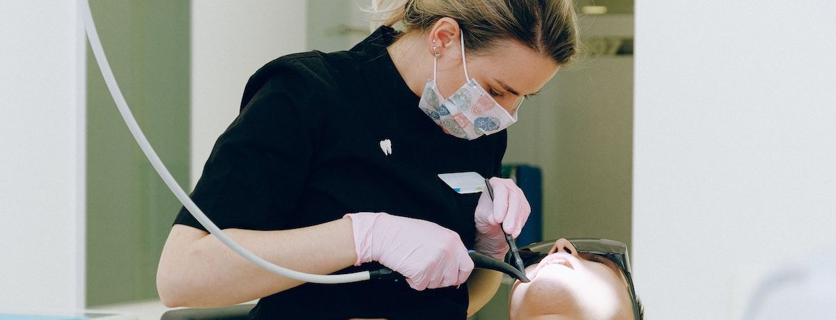 Houston dentist treating a patient who came in after a dental marketing campaign