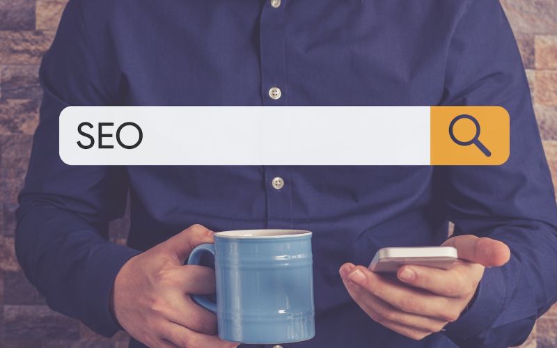 man running a search to find businesses near him with top Houston SEO rankings