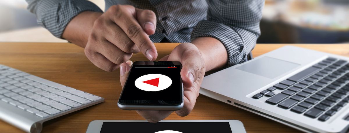 marketing professional testing video marketing on desktop website, tablet website, and mobile website