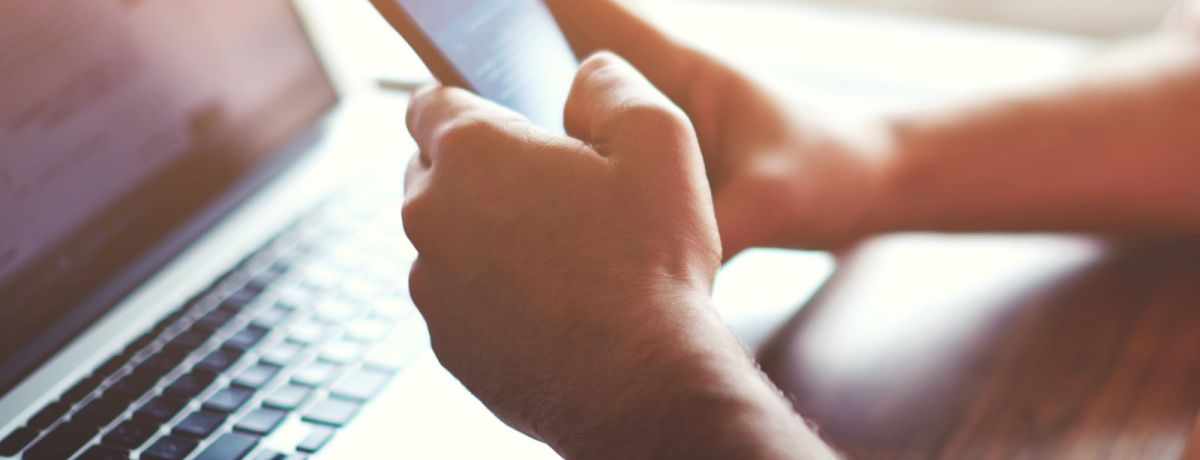 Customer browsing a Houston business's website on laptop and on mobile