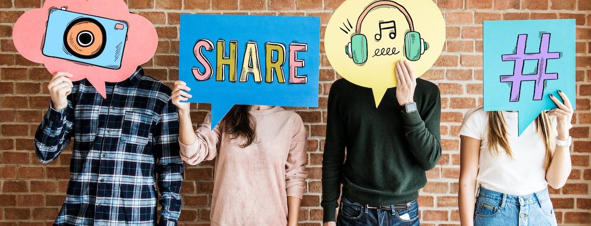 houston social media marketing team holding posters of different icons