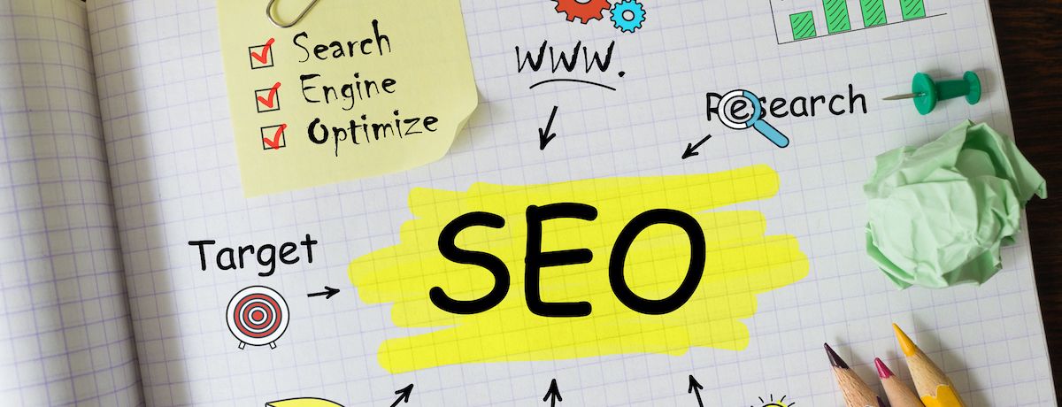 Notebook showing SEO and the different components that go into an effective Houston SEO strategy