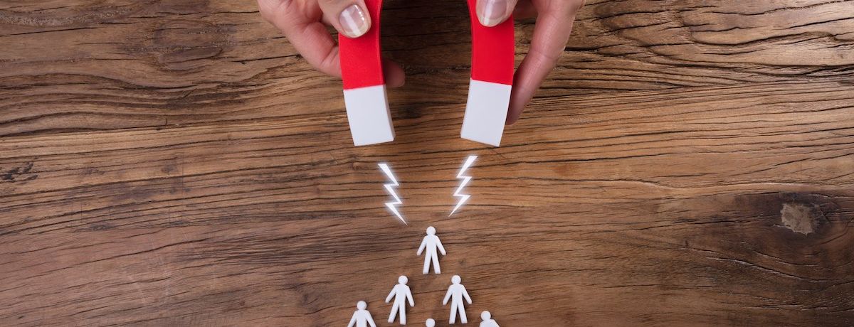 Graphic of magnet attracting several new leads to illustrate how a Houston business can get more leads