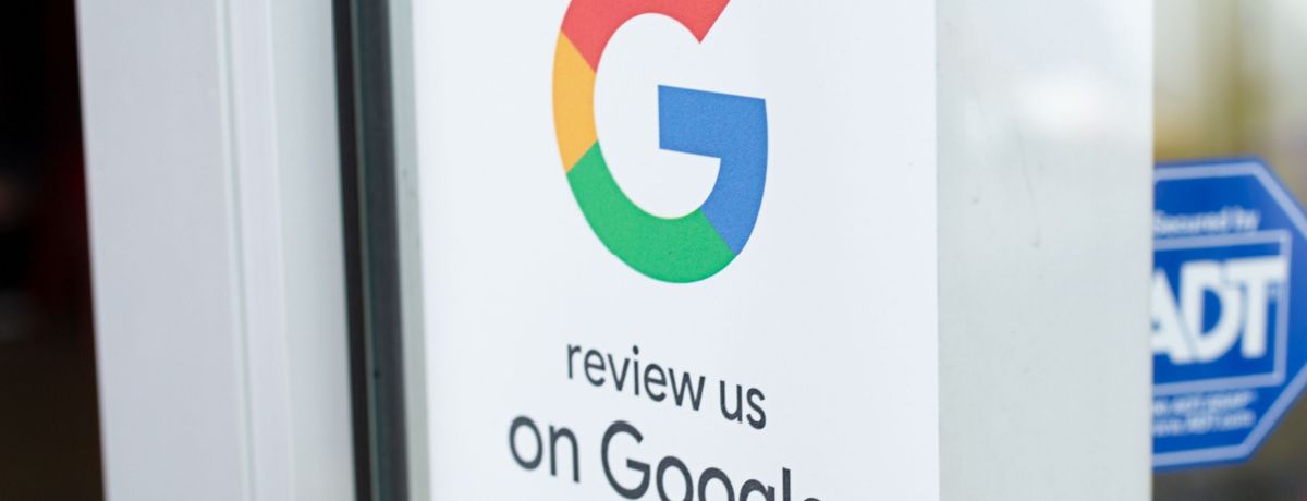 Sign encourages customer to review Houston business on google.
