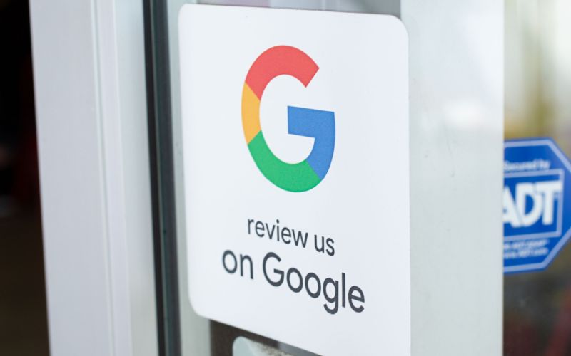Sign encourages customer to review Houston business on google.