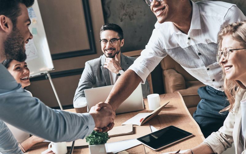 team closing a new deal with a marketing agency to expand their business