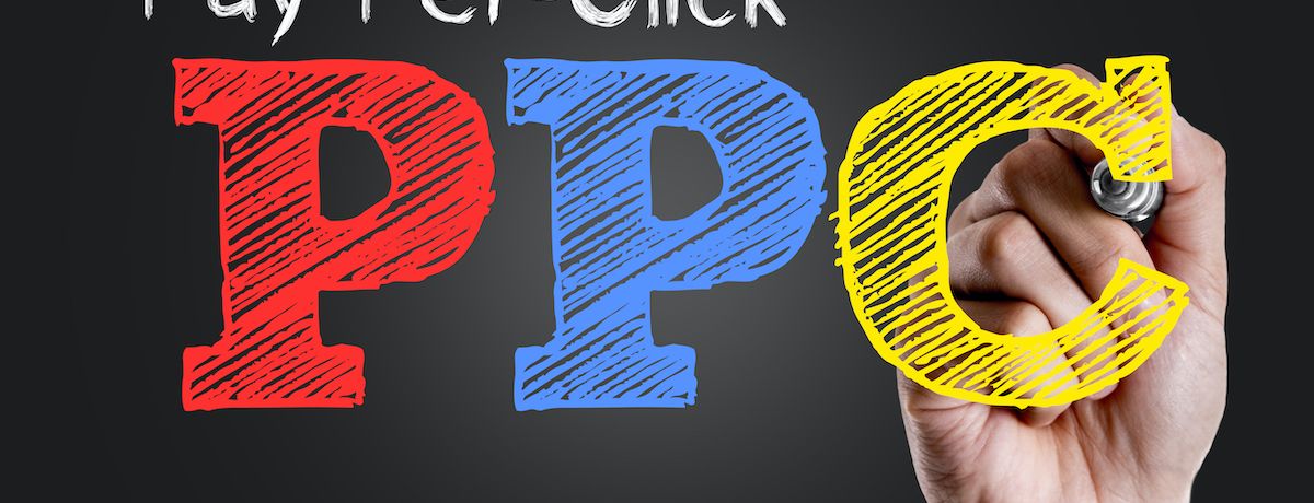 Graphic of someone drawing in PPC to represent Google Ads and PPC campaigns