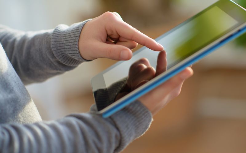 Houston business customer browsing new website design on tablet