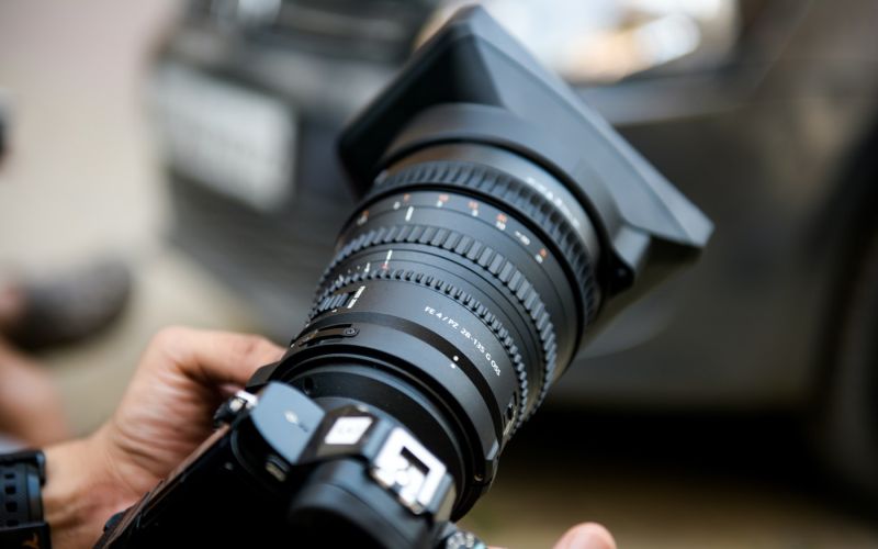 Close-up of photographer shooting product photos for a company's branding and marketing strategy