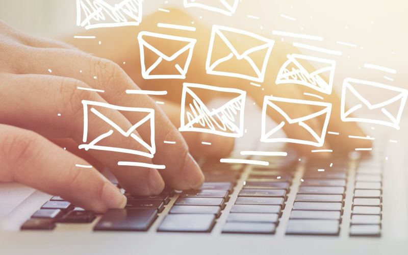 image of business owner sending marketing emails