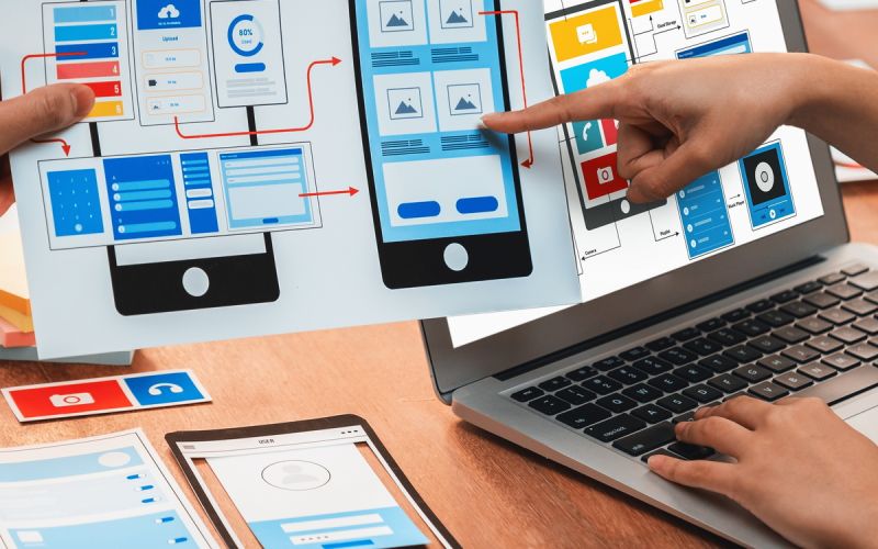 A Houston web designer working on the mobile-ready version of the site for an improved user experience.