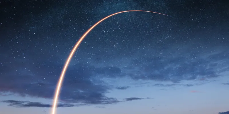 Rocket launching into the night sky
