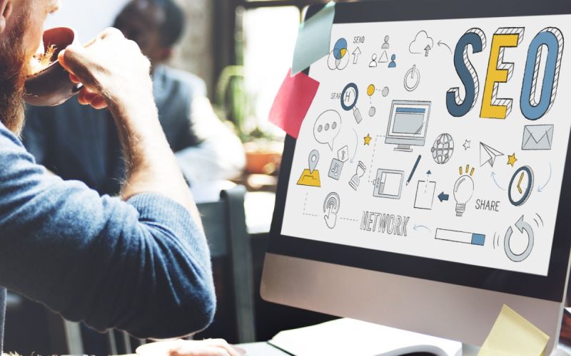 Developer integrates SEO to his custom Houston web design while drinking coffee.