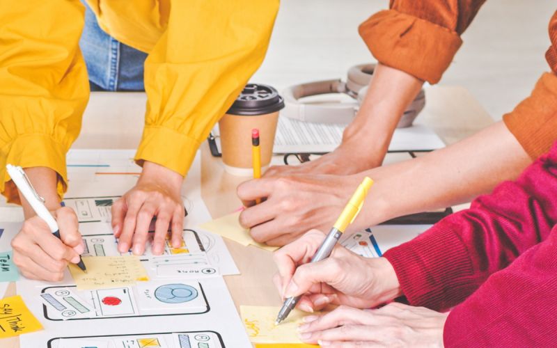 Members of a cross-functional team from a Houston marketing agency formulating a Houston marketing strategy for a client.