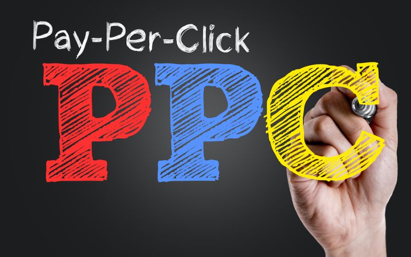 Graphic of someone drawing in PPC to represent Google Ads and PPC campaigns