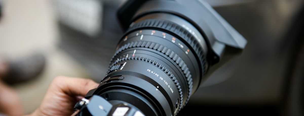 Close-up of photographer shooting product photos for a company's branding and marketing strategy