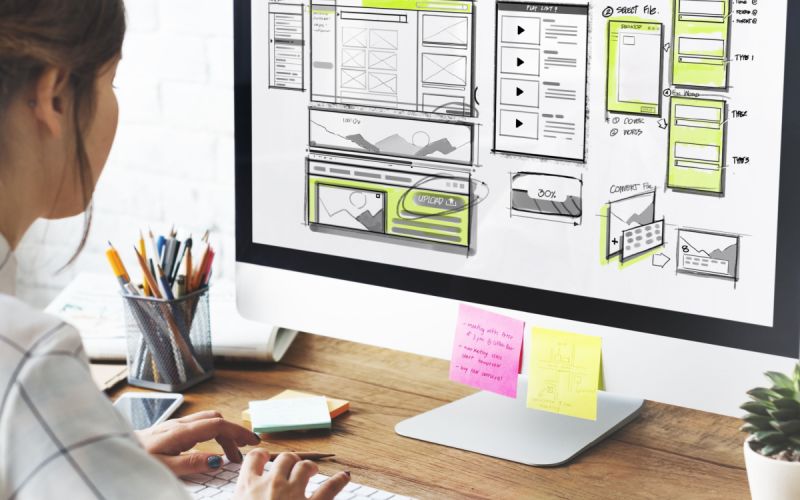 A Houston marketing agency designer performing Houston web design to implement a client's Houston digital marketing strategy.