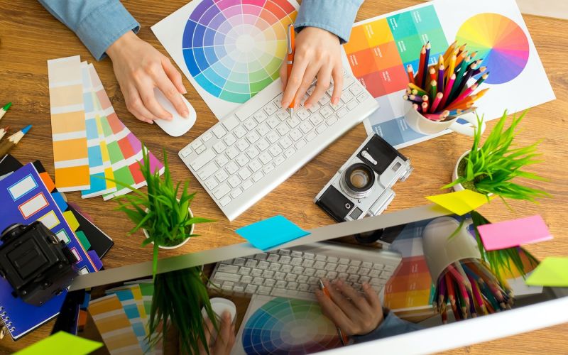 Houston marketing agency in-house graphic designer designing a new logo