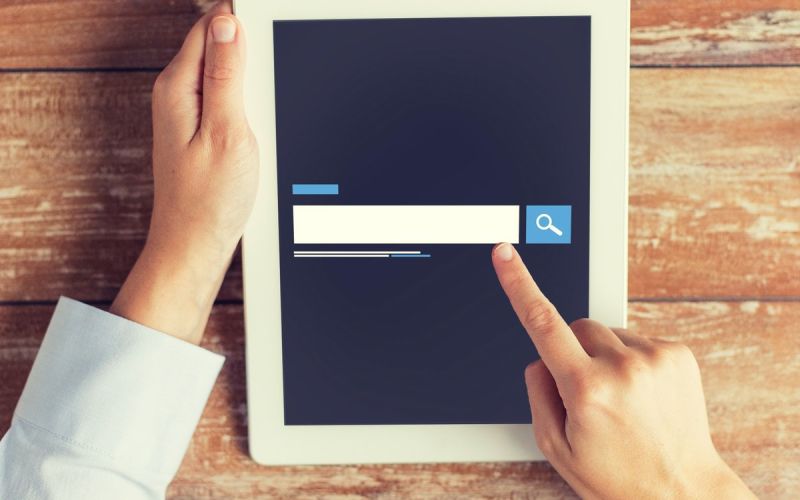 Business owner running a search for a Houston marketing company's SEO tips