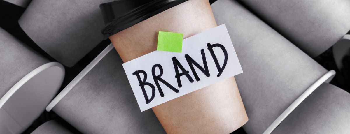 image of a branded coffee cup standing out amongst coffee cups without a brand
