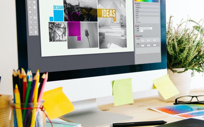 Graphic designer's desk as they plan new visuals for Houston digital marketing strategy